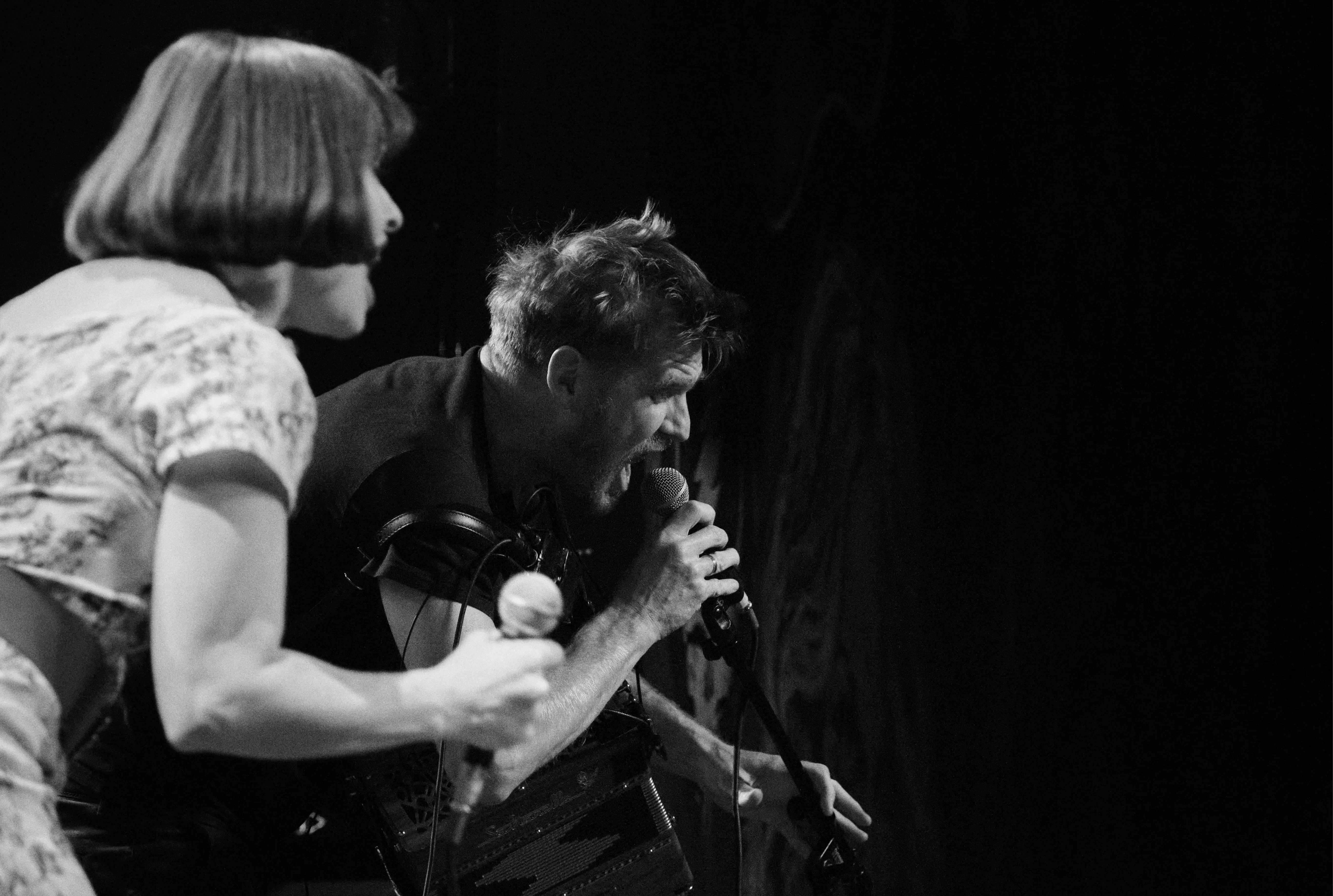 Black and white photo of Asian dub Foundation performing at Rock for Churchill
