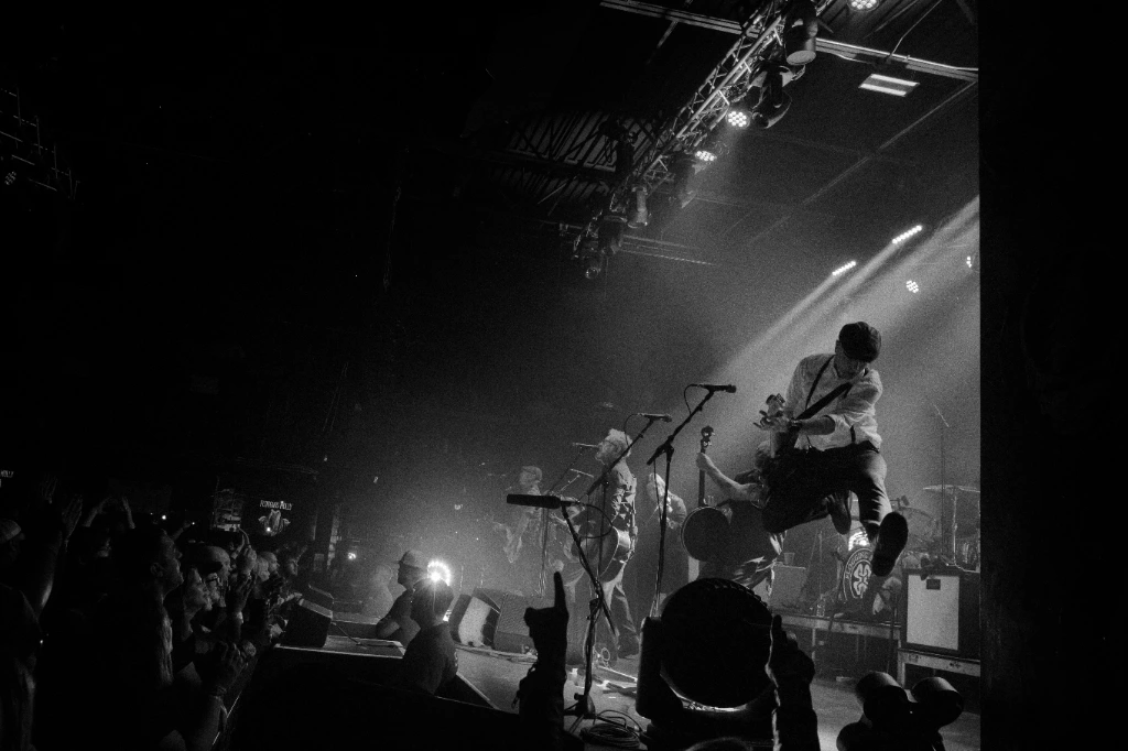 Black and white photo of Asian dub Foundation performing at Rock for Churchill