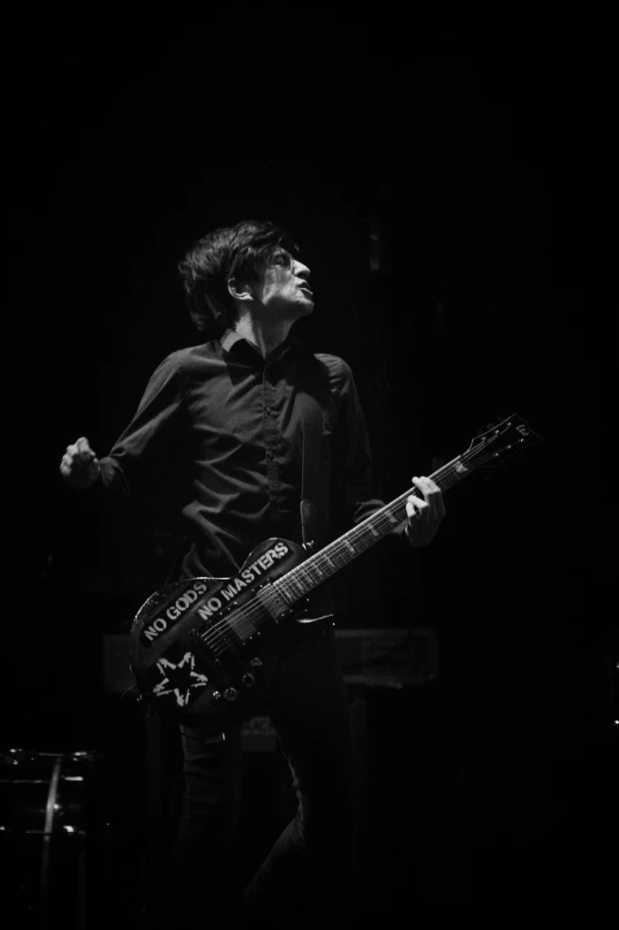 Black and white photo of Asian dub Foundation performing at Rock for Churchill