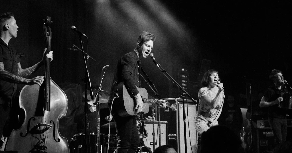 Black and white photo of Asian dub Foundation performing at Rock for Churchill
