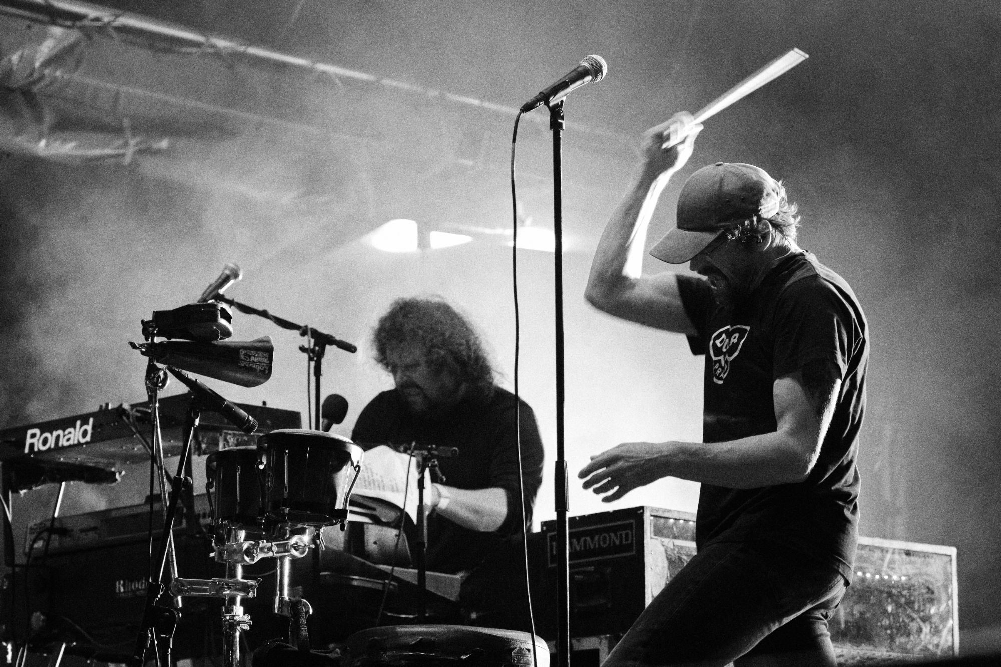 Black and white photo of Dan Barta and Roman Holy from J.A.R. perfoming at Rock for Churchill