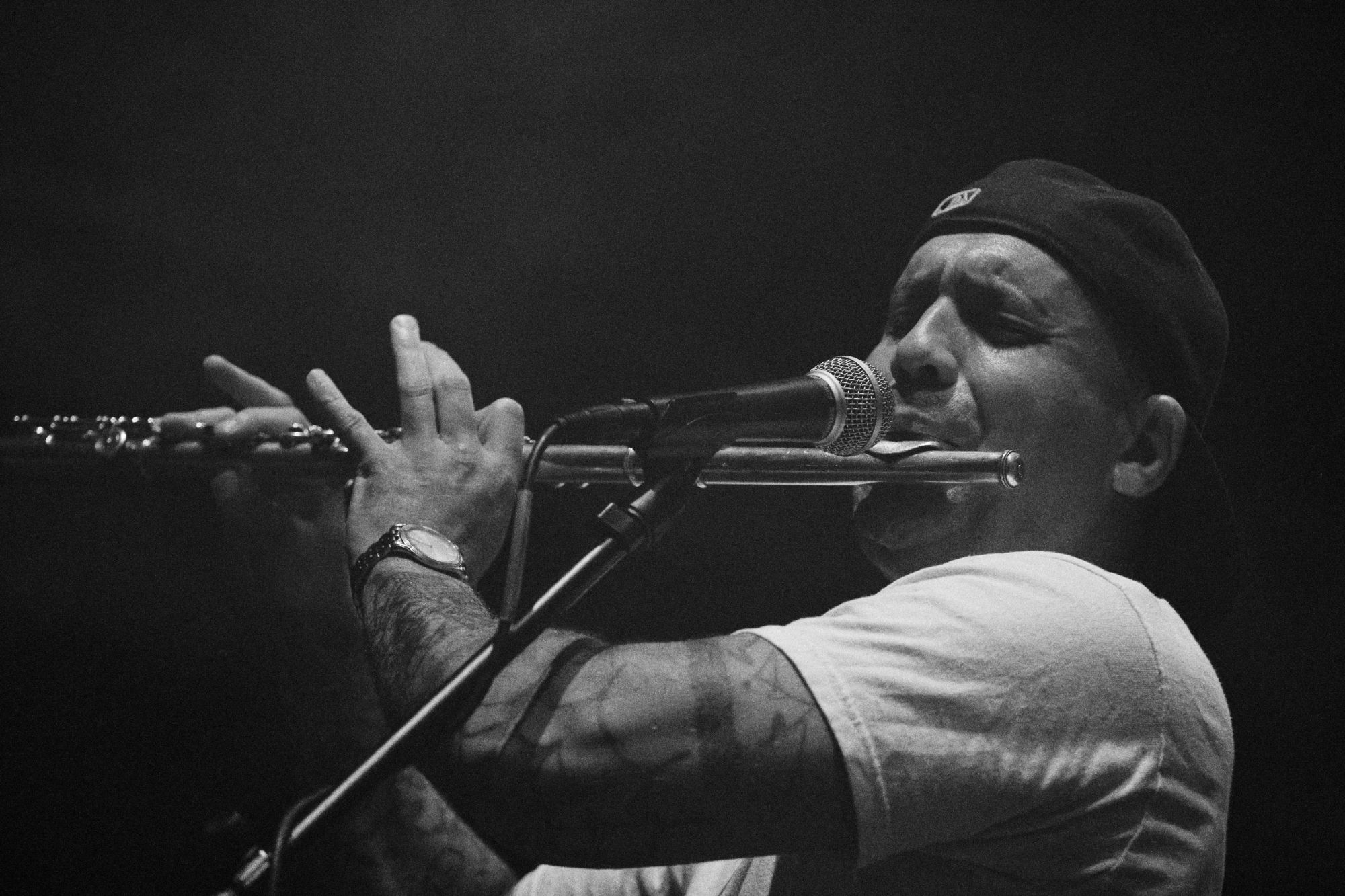 Black and white photo of Asian dub Foundation performing at Rock for Churchill