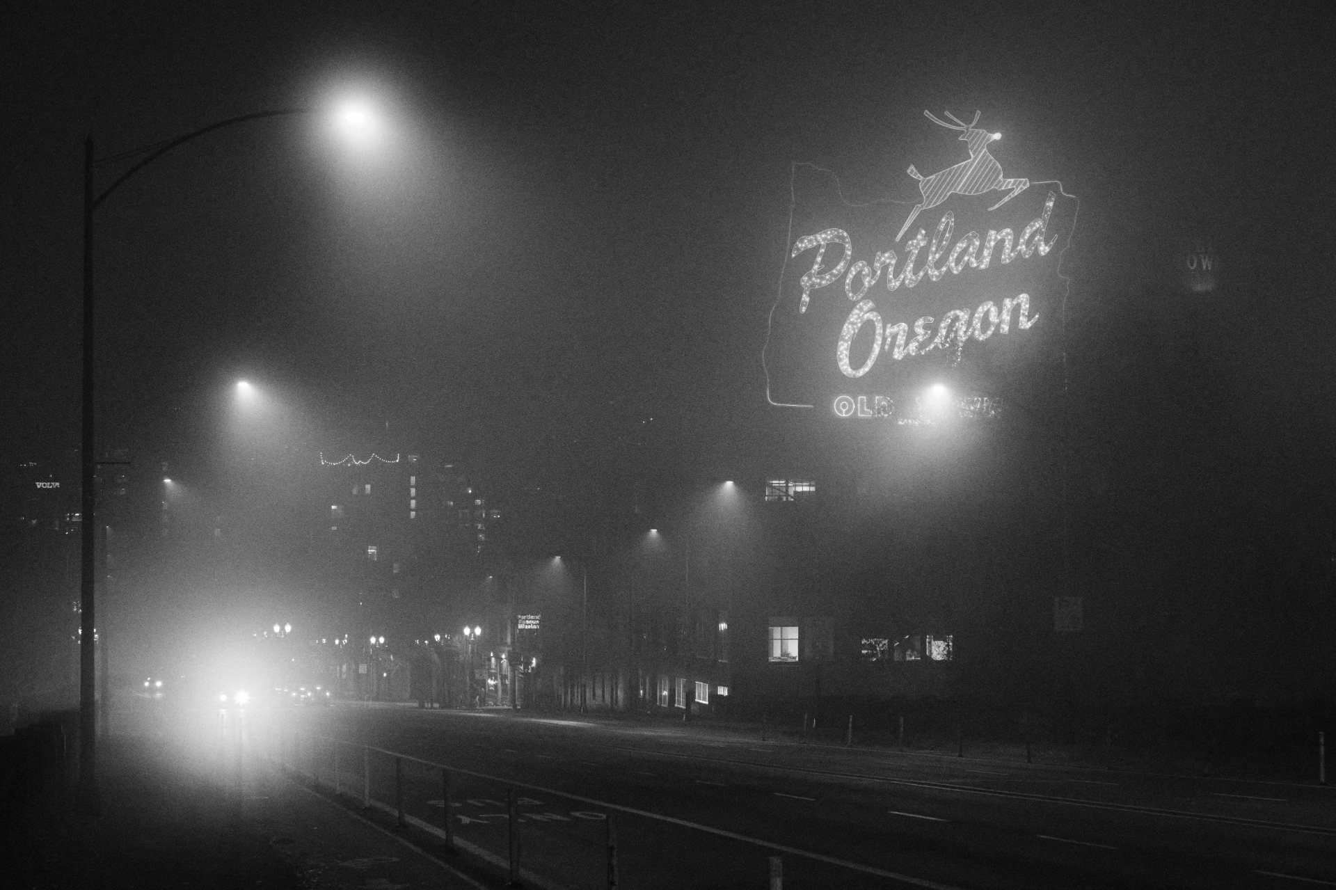 Back and white night photo of neon sign Portland Oregon